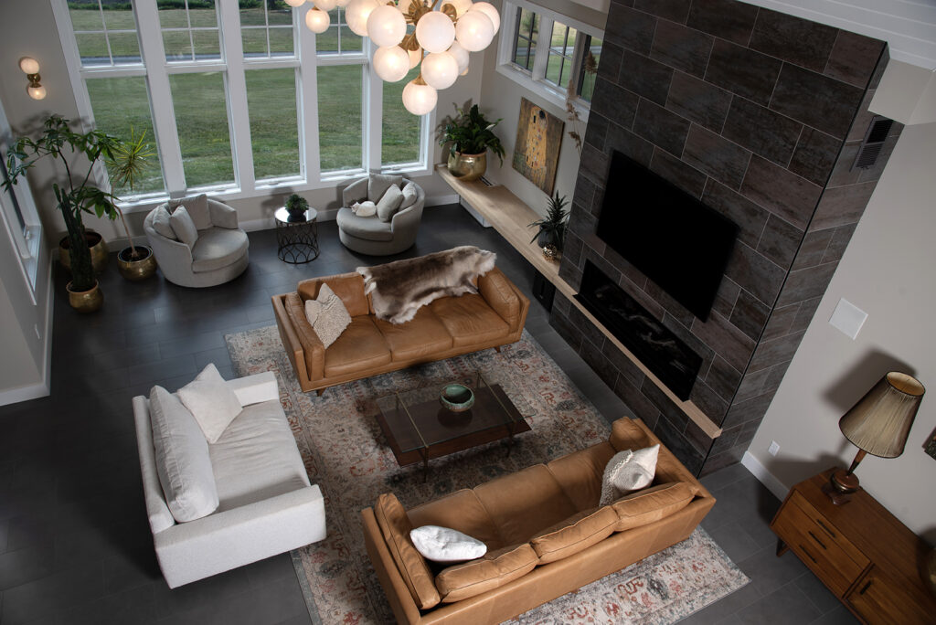 A Spacious Living Room Featuring a Large Window That Illuminates a Comfortable Couch