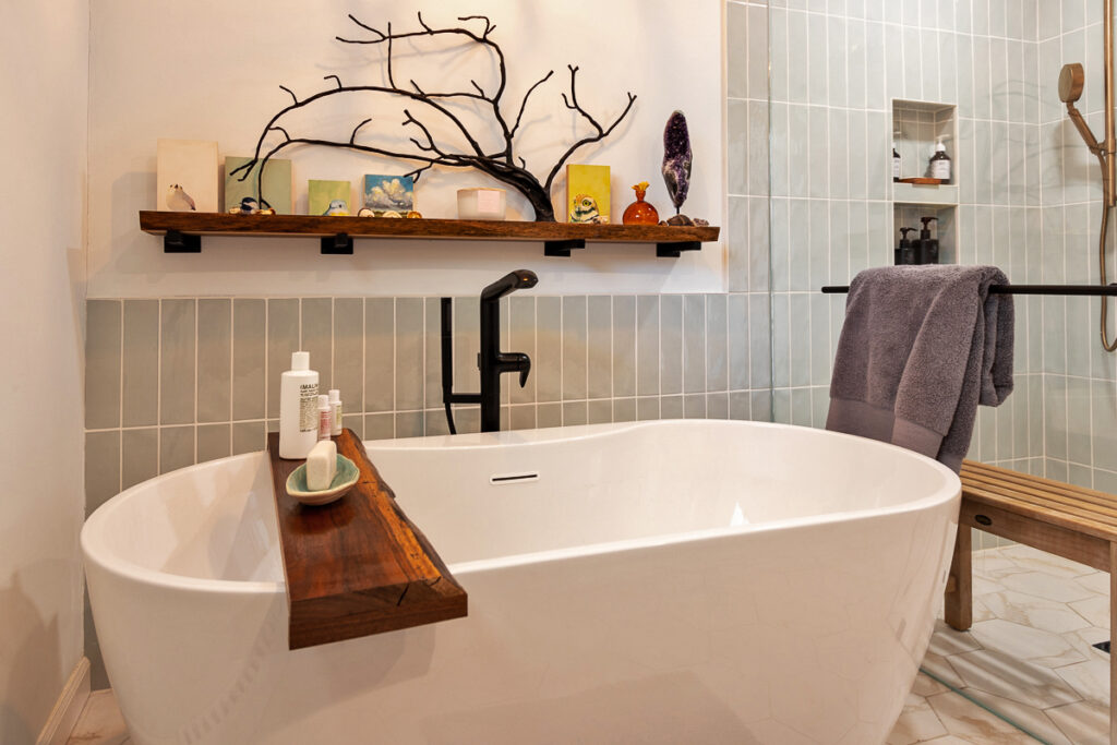 A Serene Bathroom Featuring a Spacious Bathtub Alongside a Stylish Bench