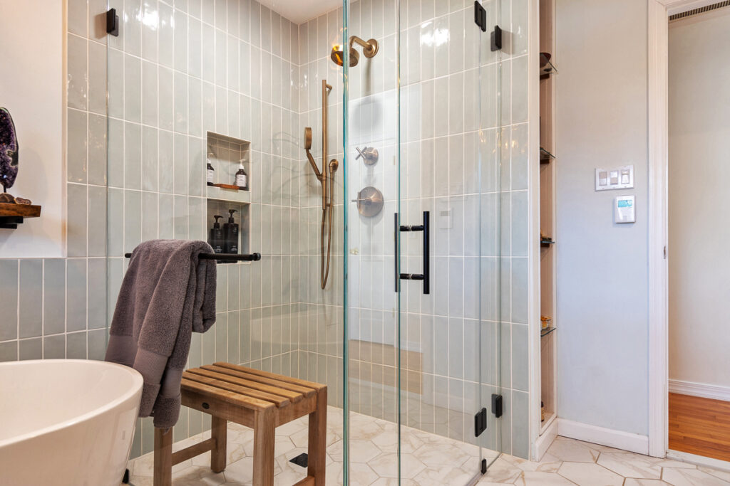 A Modern Bathroom Featuring a Glass Shower Door