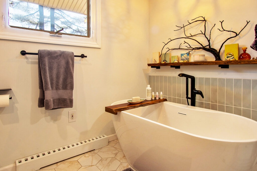 A Clean Bathroom Featuring a White Bathtub