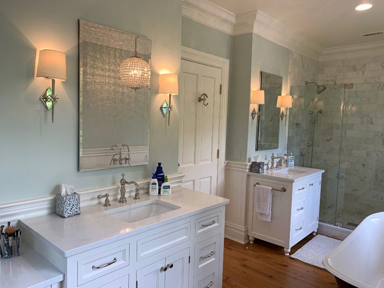 A Modern Bathroom Featuring a Double Sink and a Spacious Shower Area