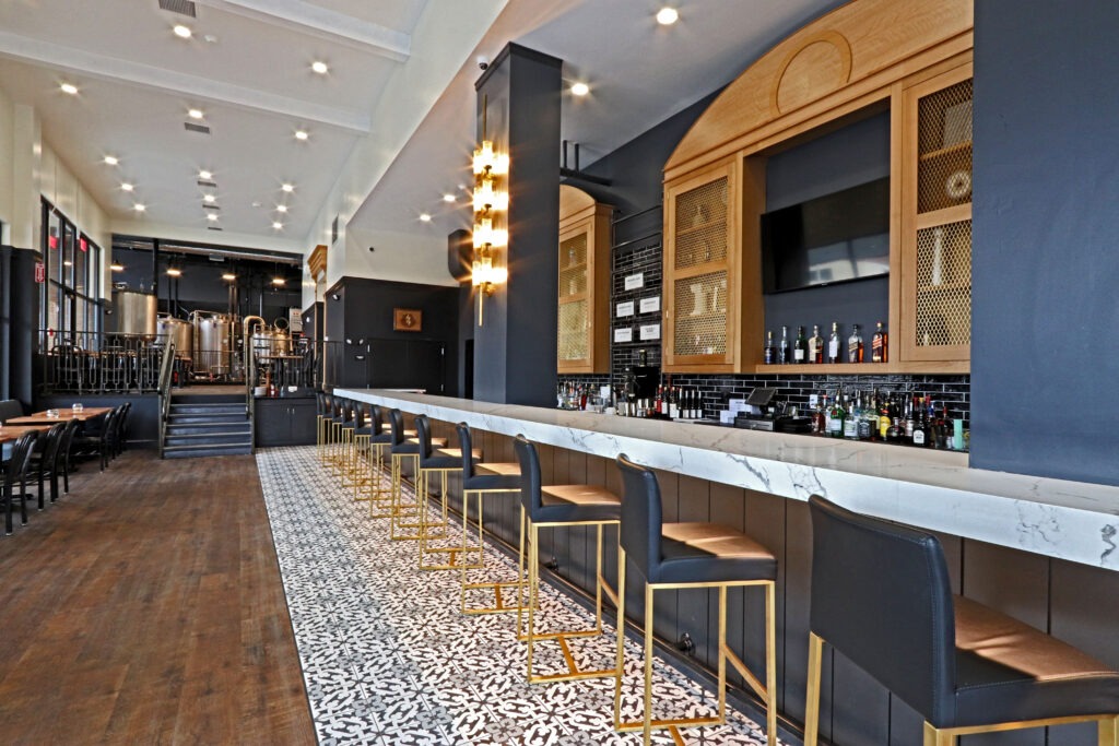 A Stylish Bar Featuring Elegant Black and Gold Accents