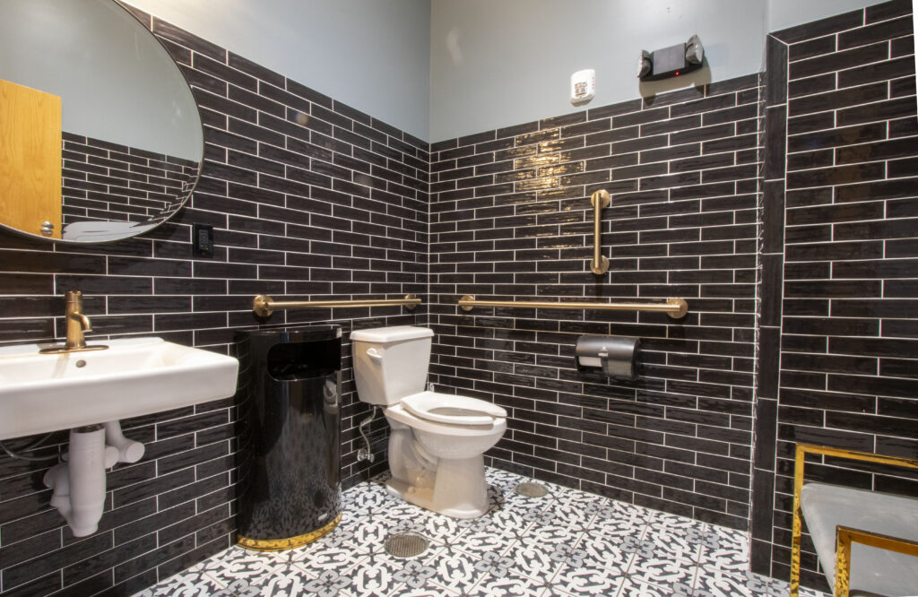 A Stylish Bathroom Showcasing Black Tiled Walls