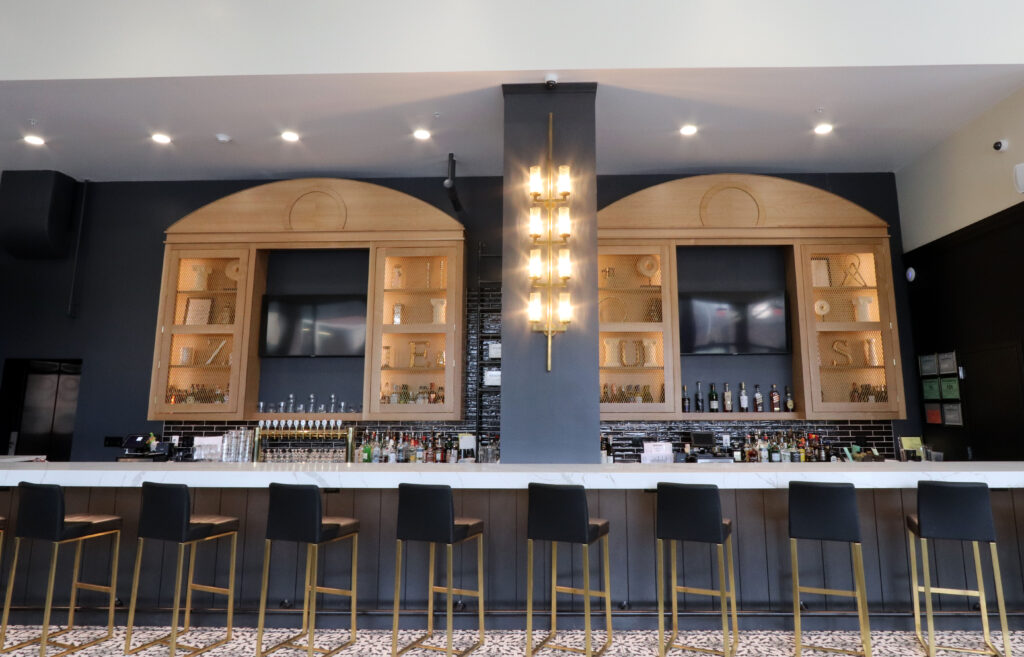 A Stylish Hotel Bar Adorned in Black and Gold