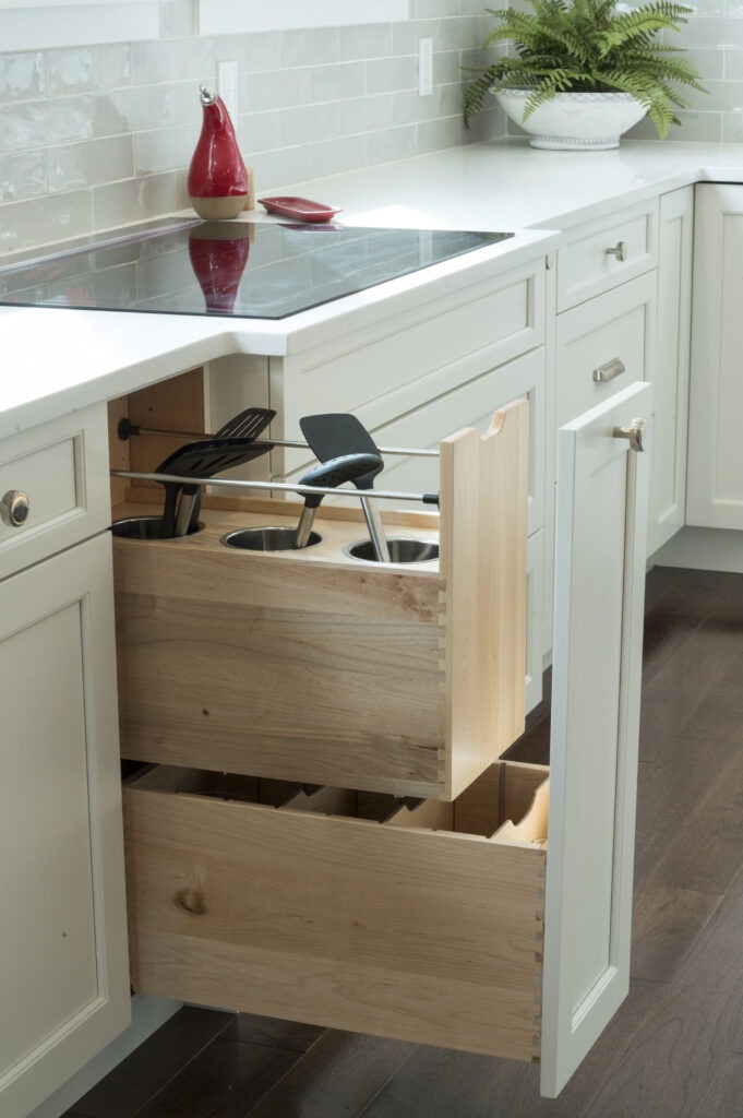custom kitchen cabinetry with a pull-out utensil drawer
